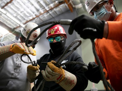 Apprentices sort through wire ropes called chokers at Iron Workers in Benicia on June 20, 2021. Photo by Anne Wernikoff, CalMatters