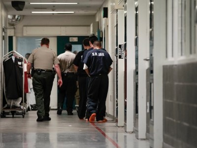 Sheriff's Deputies escorts inmates down a secured hallway at downtown Central Jail in San Diego in 2015. Photo by Nelvin C. Cepeda, The San Diego Union-Tribune via AP Photo
